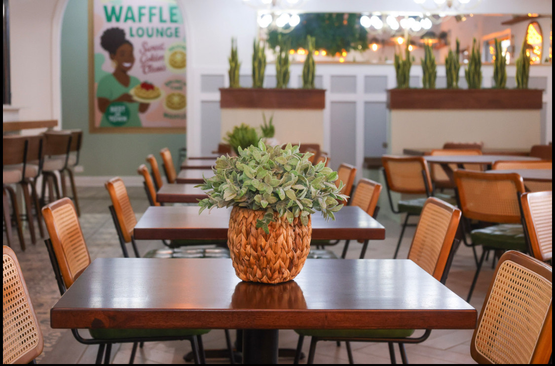 Restaurant interior with decorative pineapple planter centerpiece